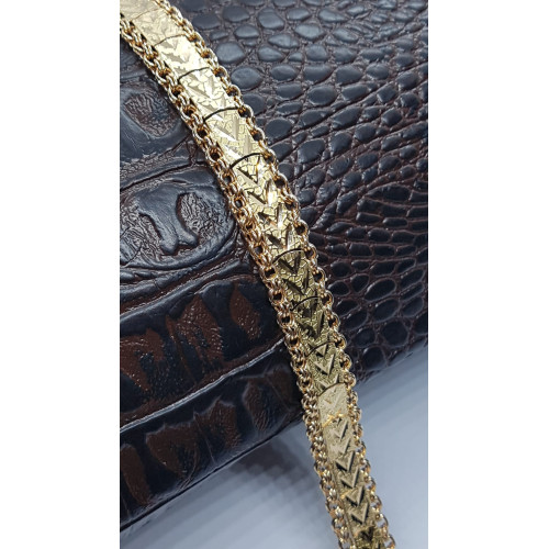 Pulsera de oro amarillo con decoración floral