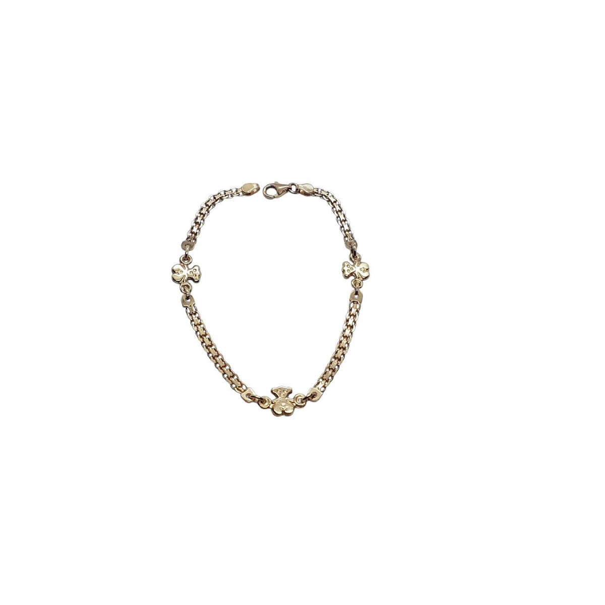 Pulsera maciza y articulada de oro amarillo, contiene tres osos