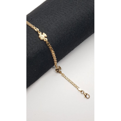 Pulsera maciza y articulada de oro amarillo, contiene tres osos