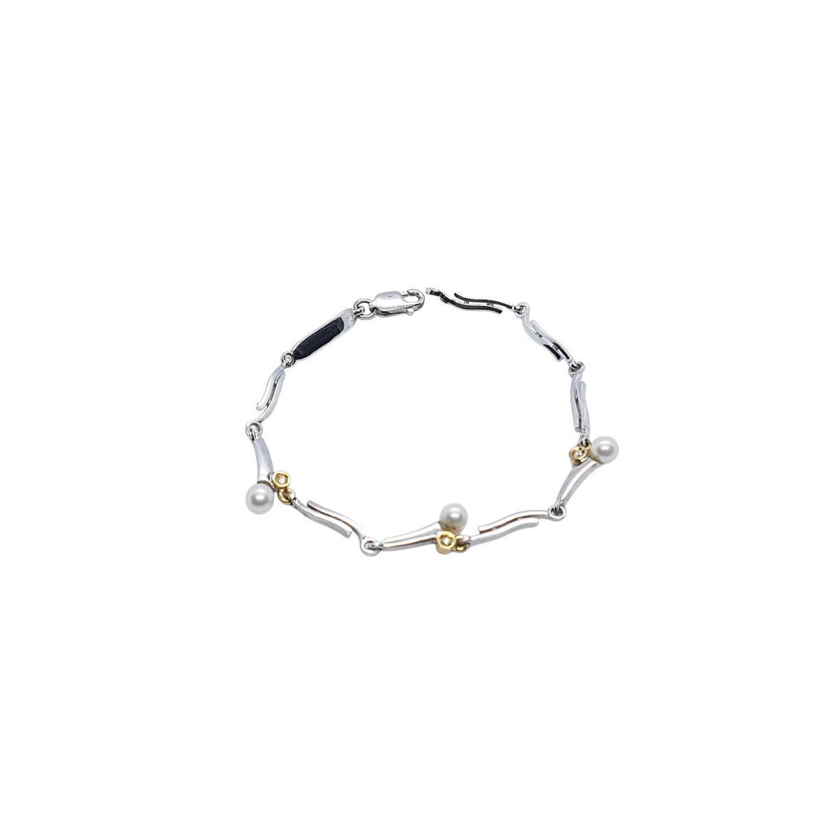 Pulsera maciza y articulada de plata combinada con oro, perlas y diamantes
