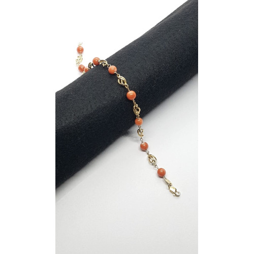 Pulsera articulada de oro amarillo con coral