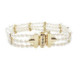 Pulsera de oro amarillo con perlas naturales cultivadas y diamantes negros y blancos