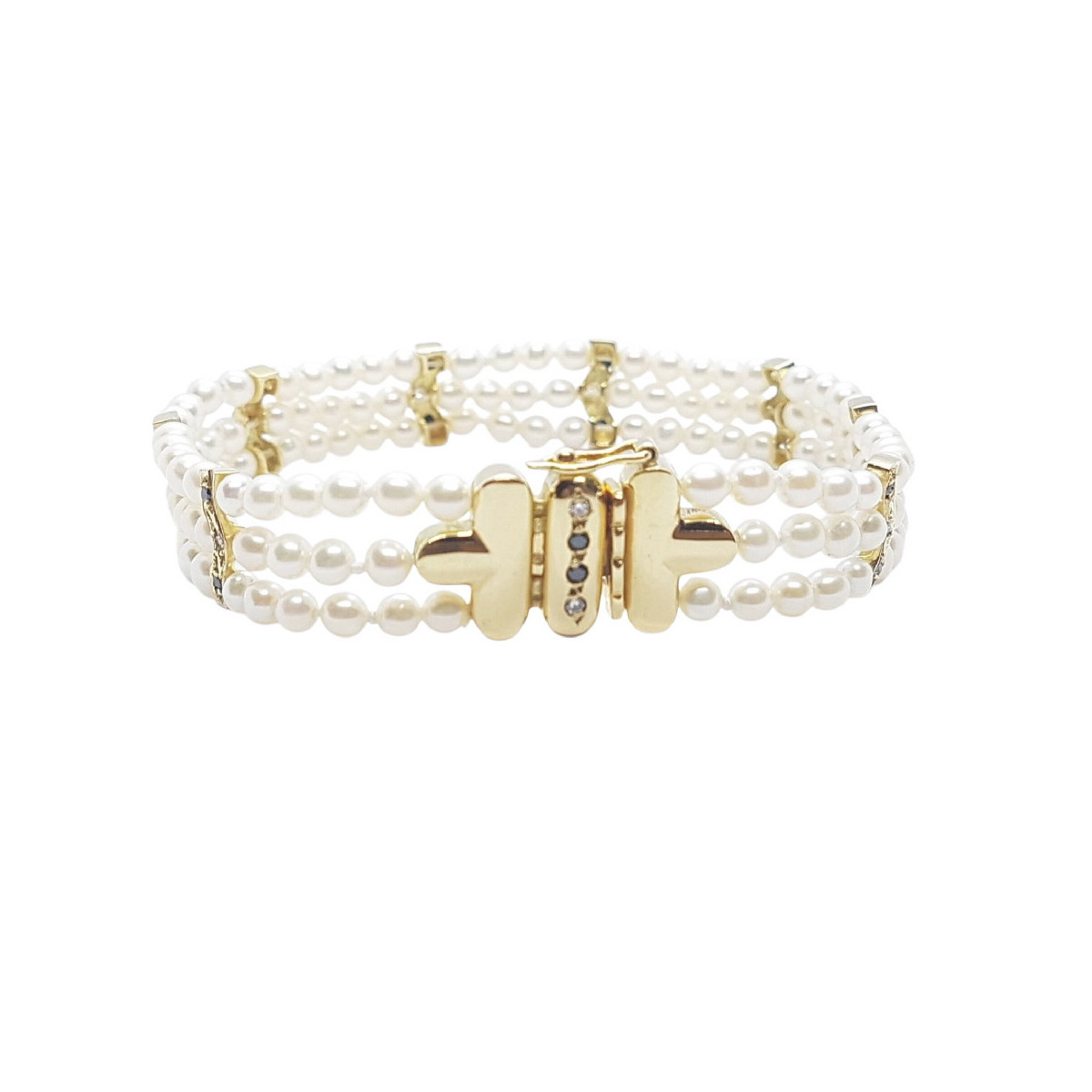 Pulsera de oro amarillo con perlas naturales cultivadas y diamantes negros y blancos