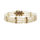 Pulsera de oro amarillo con perlas naturales cultivadas y diamantes negros y blancos