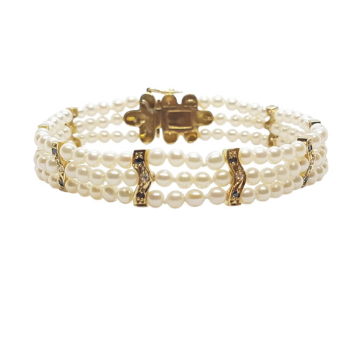 Pulsera de oro amarillo con perlas naturales cultivadas y diamantes negros y blancos
