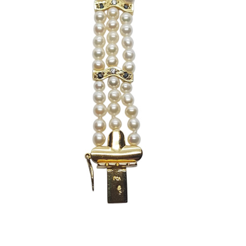 Pulsera de oro amarillo con perlas naturales cultivadas y diamantes negros y blancos