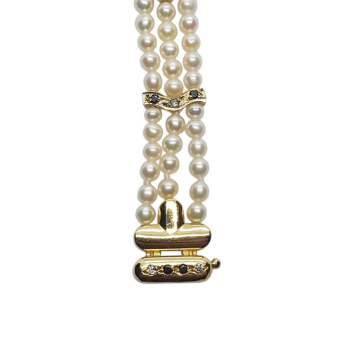 Pulsera de oro amarillo con perlas naturales cultivadas y diamantes negros y blancos