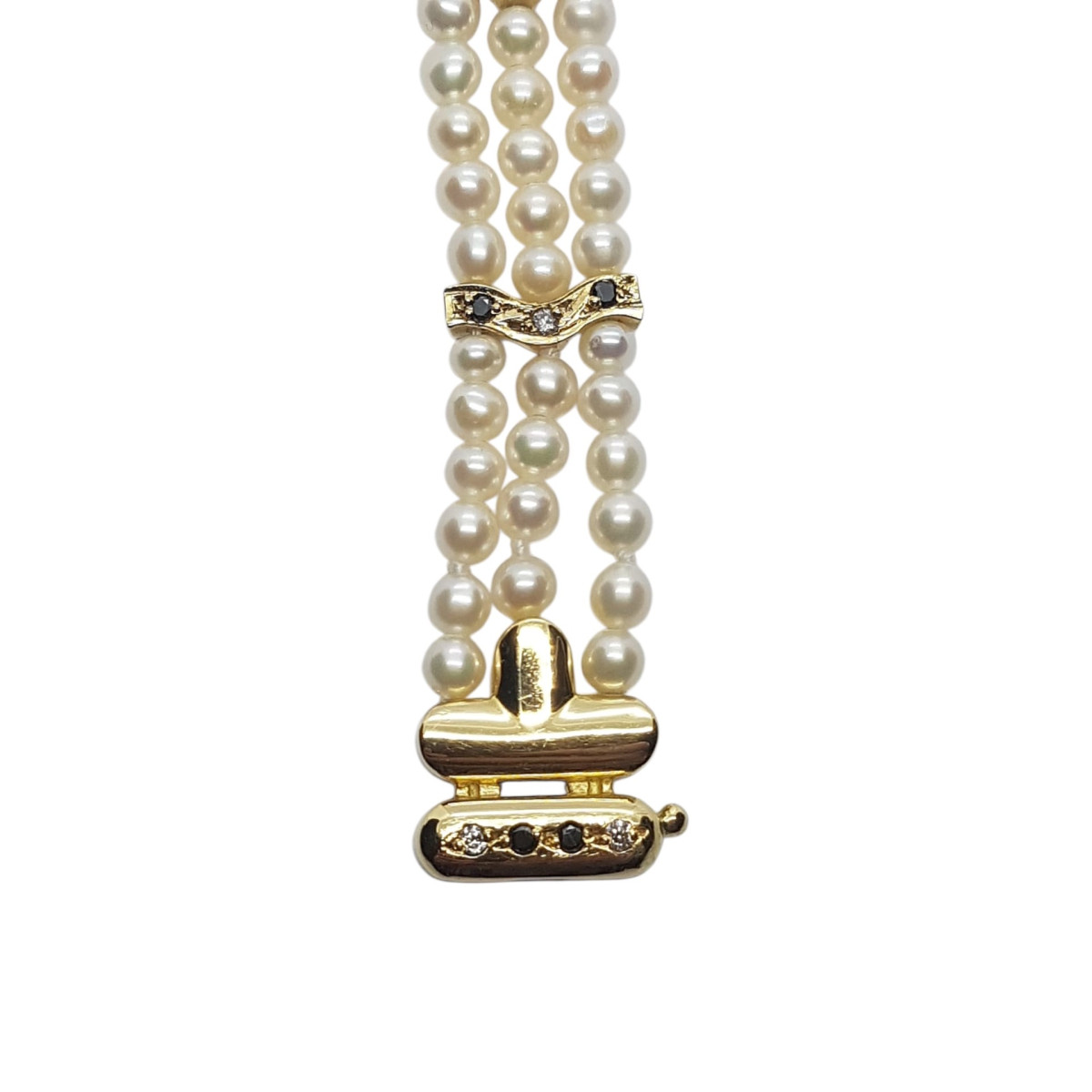 Pulsera de oro amarillo con perlas naturales cultivadas y diamantes negros y blancos