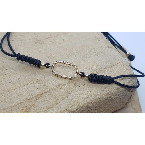 Pulsera de oro con diamantes y macramé