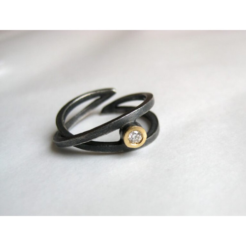 Anillo de plata y oro con diamante