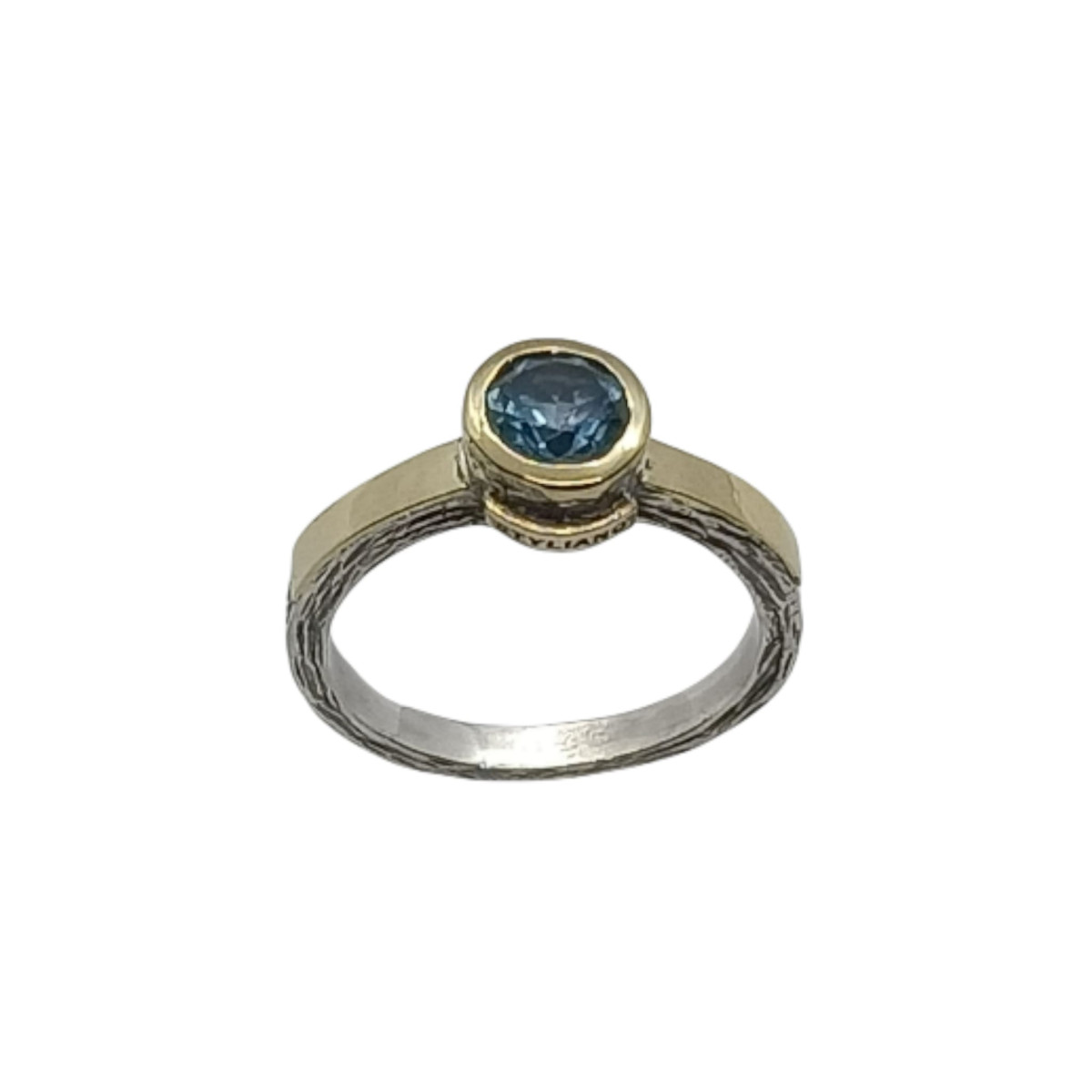 Anillo de plata y oro con topacio azul