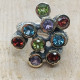 Anillo de plata y oro con peridotos, topacio azul, granates y amatistas