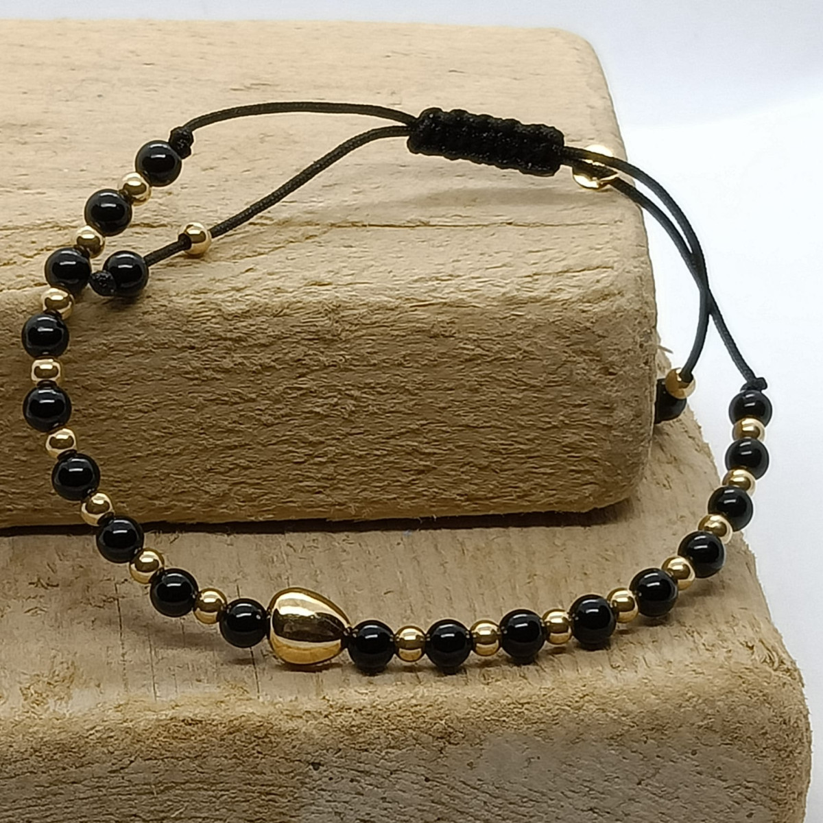 Pulsera de Ónix y oro amarillo
