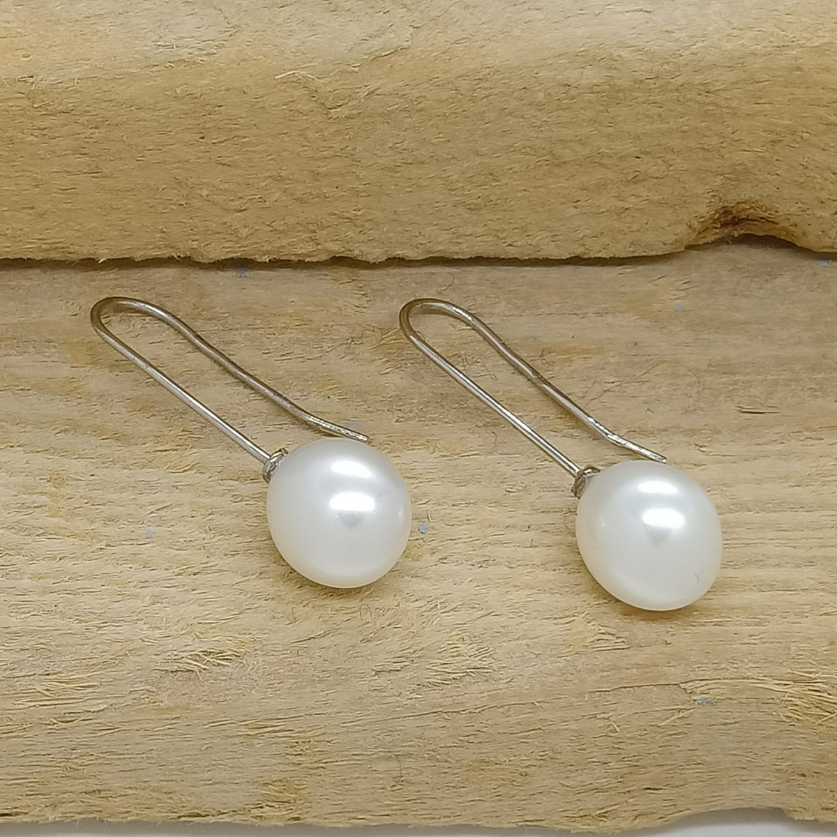 Pendientes largos de oro blanco con perlas