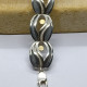 Brazalete articulado de plata y oro