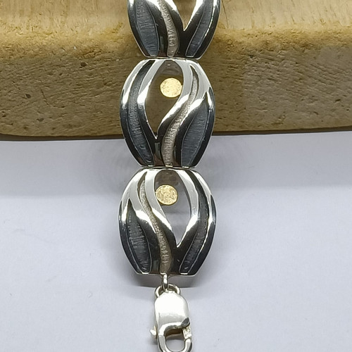 Brazalete articulado de plata y oro