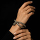 Brazalete rígido de plata y oro, en forma de serpiente, contiene iolitas