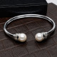 BRAZALETE RÍGIDO DE ORO BLANCO CON DIAMANTES Y PERLAS BRAZALETE RÍGIDO DE ORO BLANCO CON DIAMANTES Y PERLAS