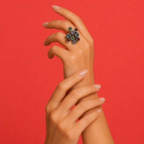 Anillo de plata y oro con peridotos, topacio azul, granates y amatistas