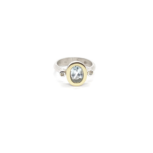 Anillo de plata y oro amarillo con diamantes y topacio azul