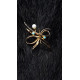 Broche de oro con perlas y turquesas