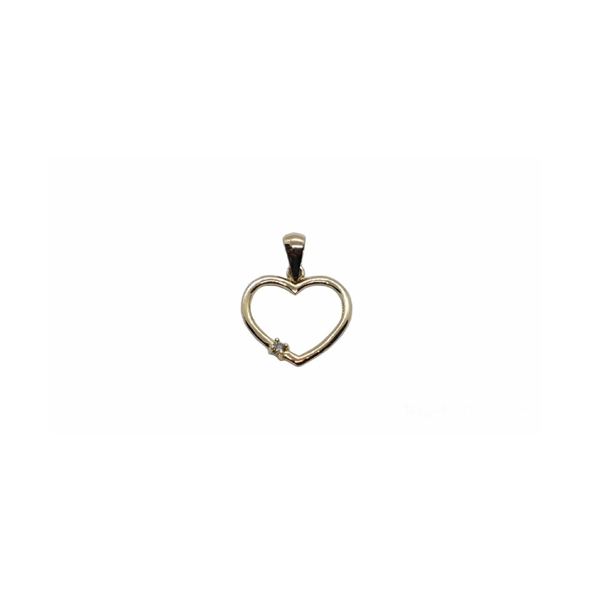 Colgante de oro amarillo con forma de corazón y diamante
