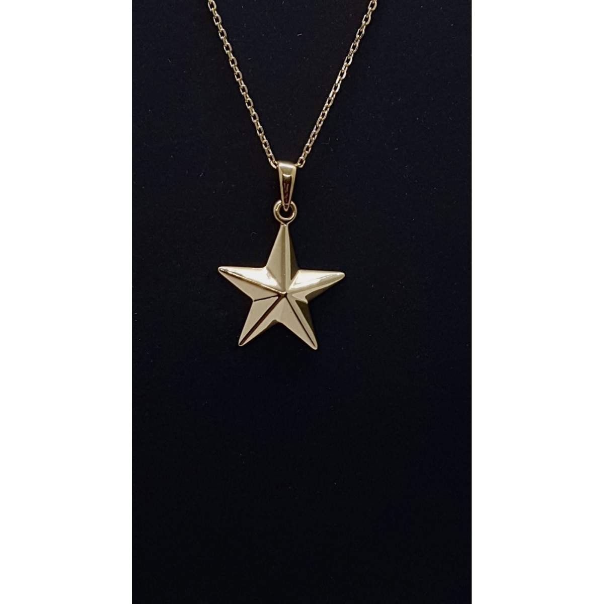 Colgante de oro amarillo con forma de estrella
