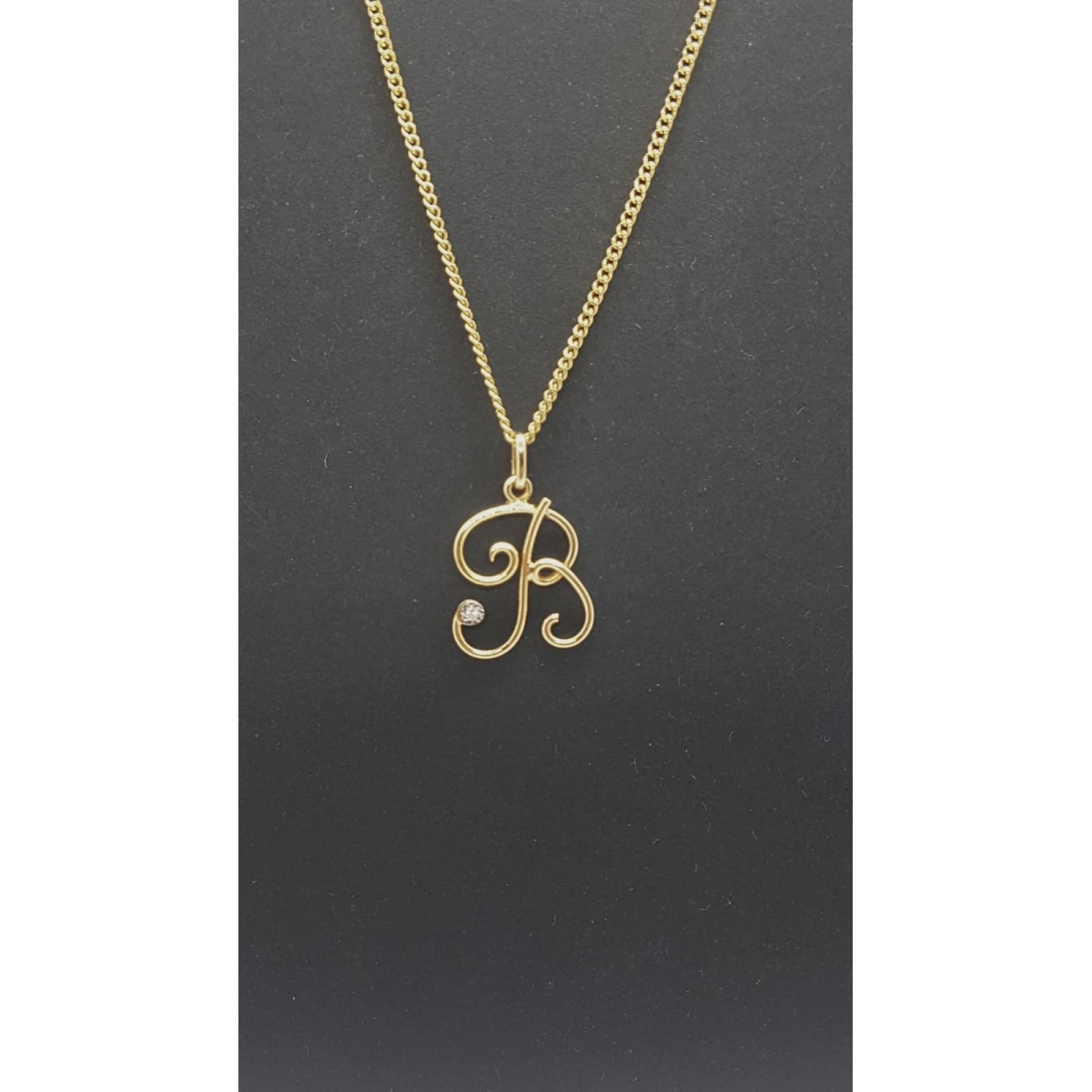 Colgante de oro amarillo con diamante - letra B