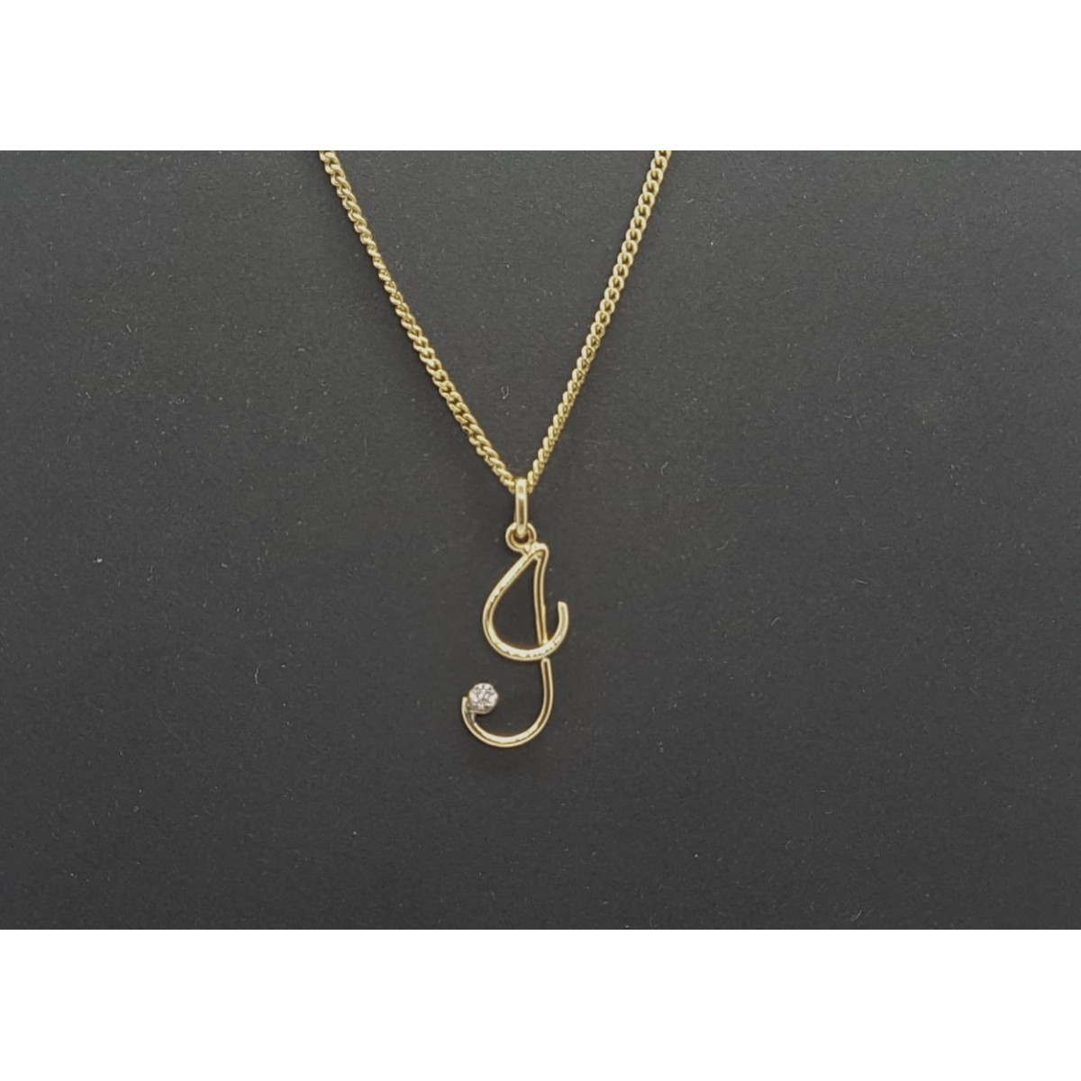 Colgante de oro amarillo con diamante - letra G