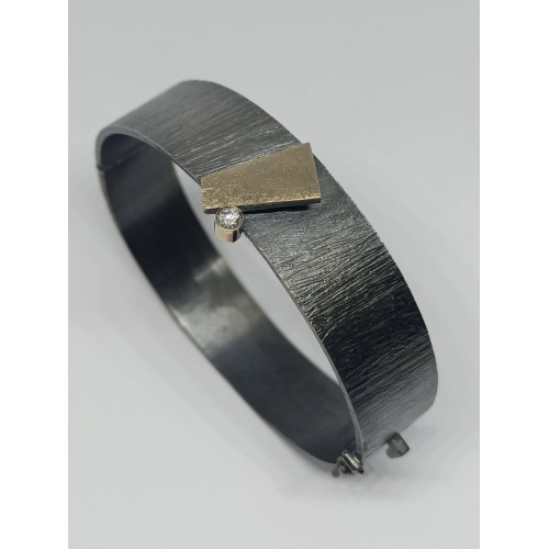 Brazalete rígido de plata, oro y diamante