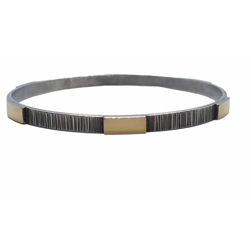 Brazalete rígido de plata y oro amarillo
