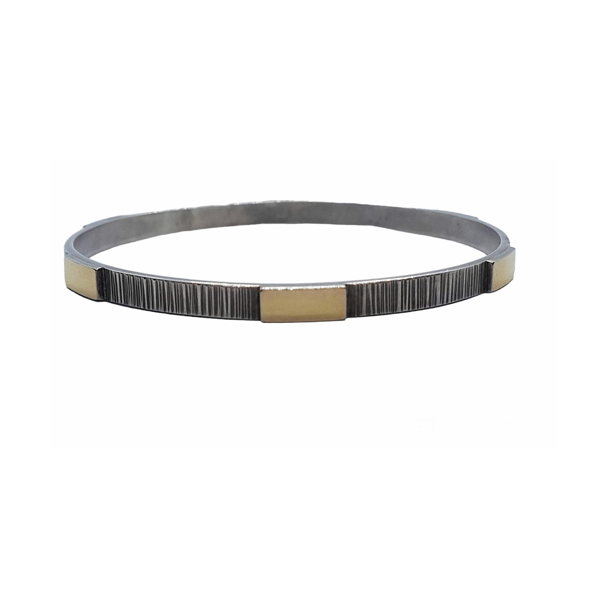 Brazalete rígido de plata y oro amarillo