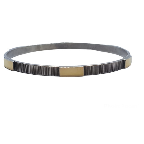 Brazalete rígido de plata y oro amarillo