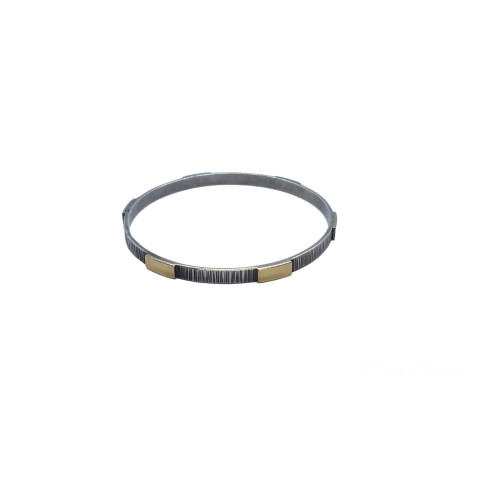 Brazalete rígido de plata y oro amarillo