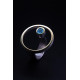 Anillo de plata y oro  con topacio azul